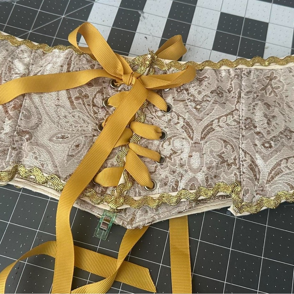 Elegant Gold and Cream Lace-Up Belt